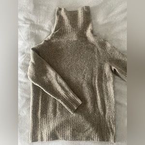 The Group by Babaton funnel neck sweater.